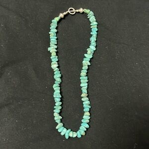 Turquoise stone necklace.